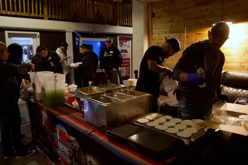 Caterers serving a hot line in the Main Hall at 1712 Studios