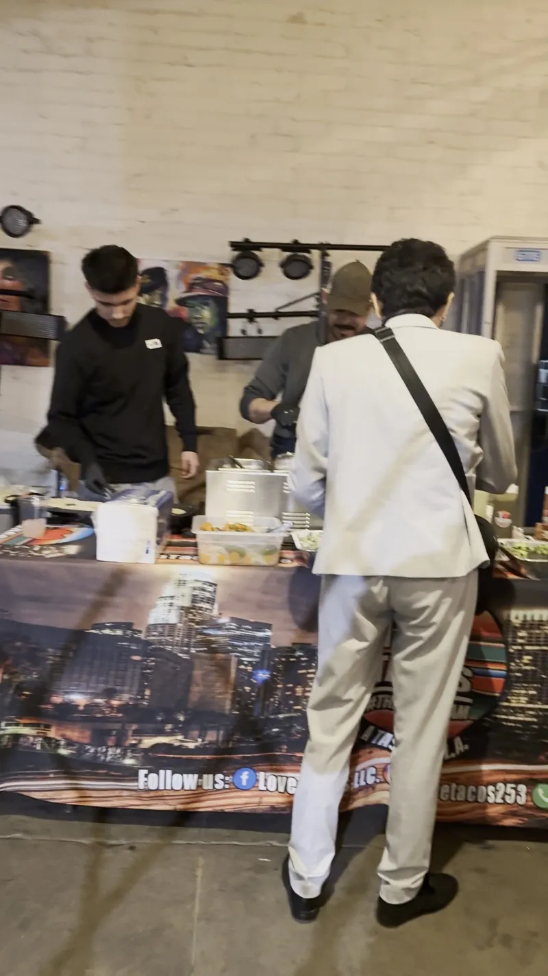A taco catering line being served in the Main Hall at 1712 Studios
