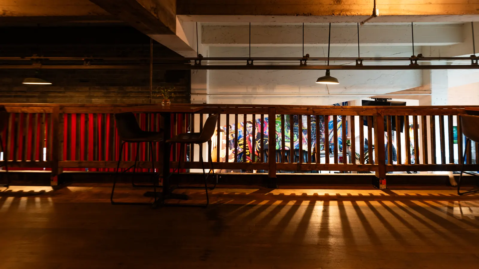 The Speakeasy balcony rail at 1712 Studios looking down over the Back Venue